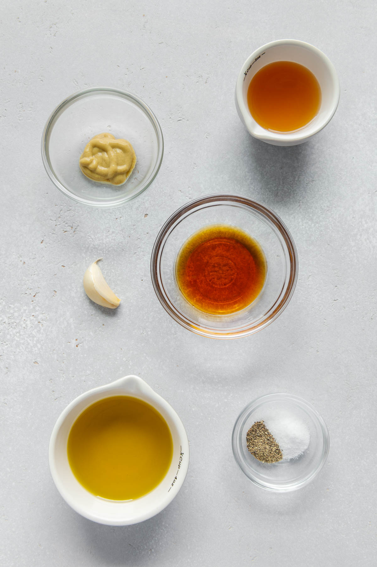 Ingredients to make Dijon cider salad dressing.