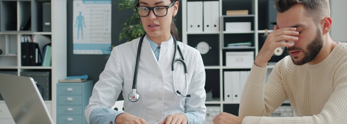 Doctor consulting with patient