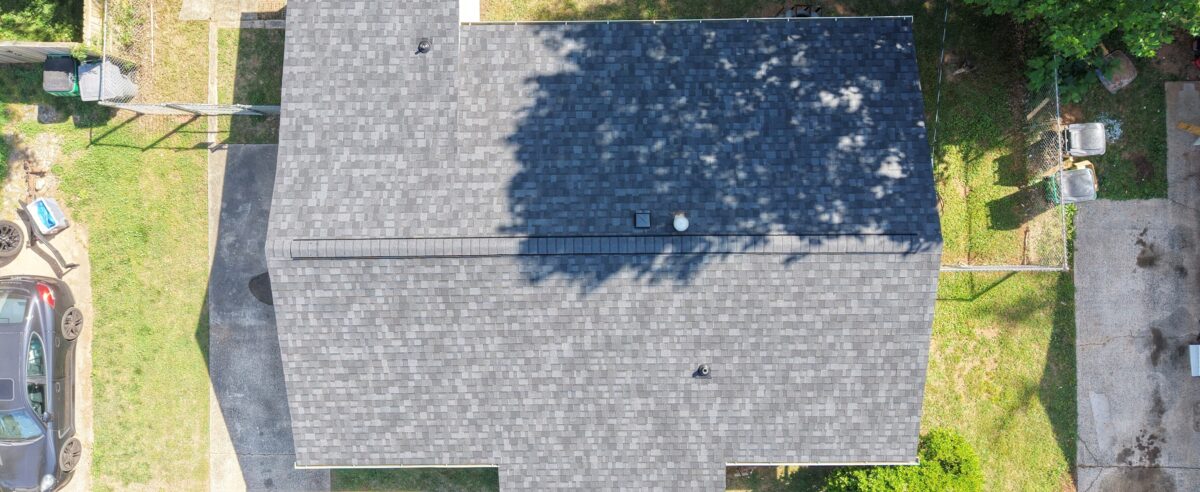 Charlotte NC home with new roof installation in progress on a clear fall day