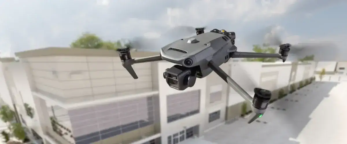 A drone patrolling over a crowded stadium with real-time monitoring equipment.