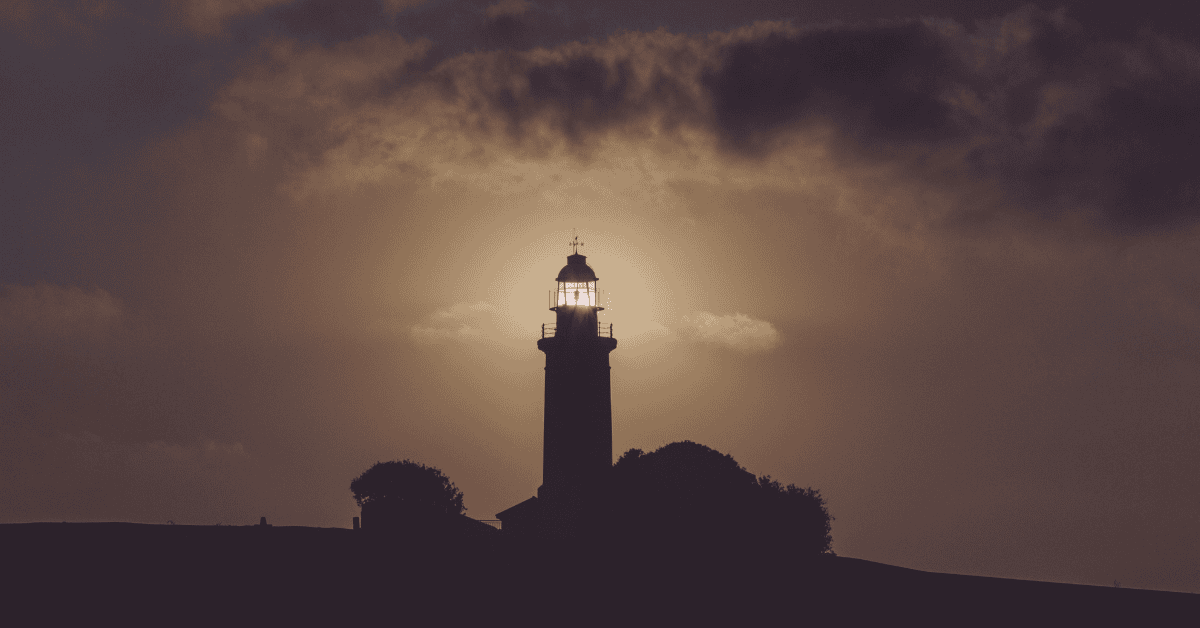 Lighthouse shining in darkness
