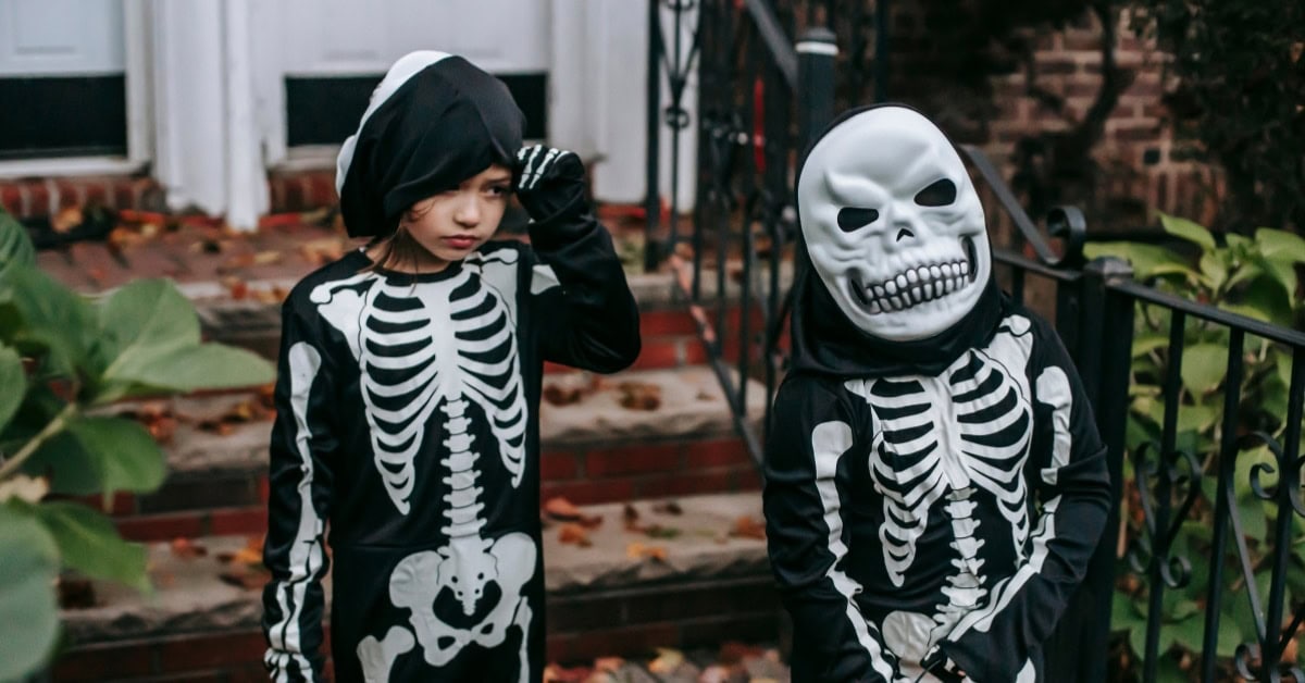 Cover Image for blog. Two kids in skeleton costumes