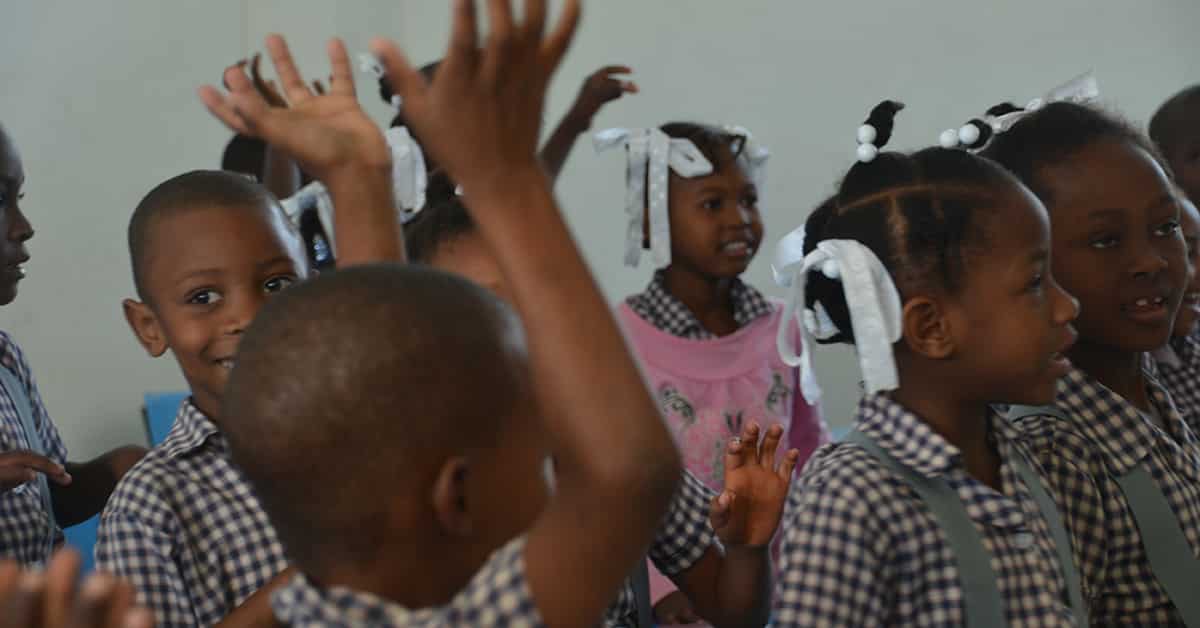 Children in Haiti relieving stress by shaking and dancing Children in Haiti shaking and dancing to relieve stress