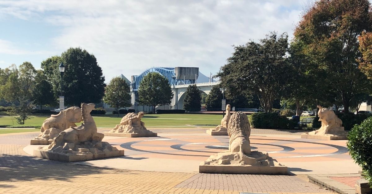 statues and bridge in park