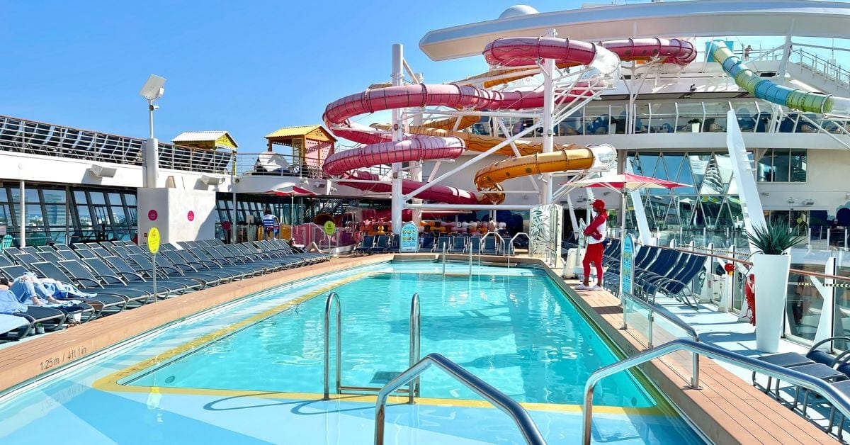 Pool on Oasis of the Seas with pink waterslide in background