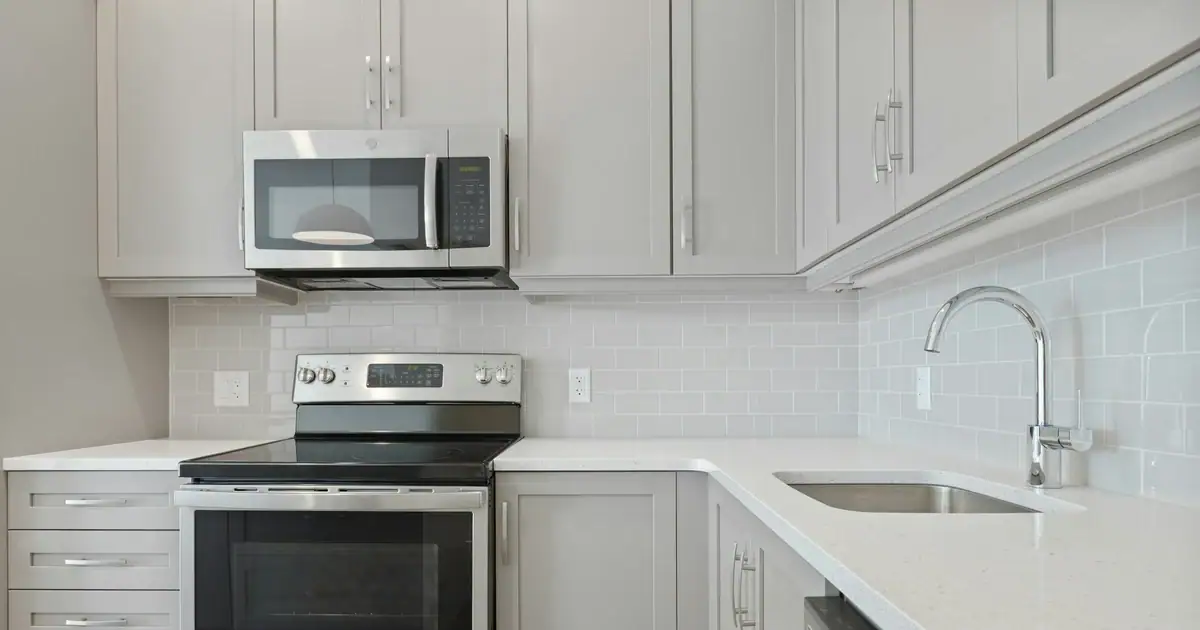 Gray shaker kitchen cabinets with quartz countertop, the most expensive part of a kitchen remodel