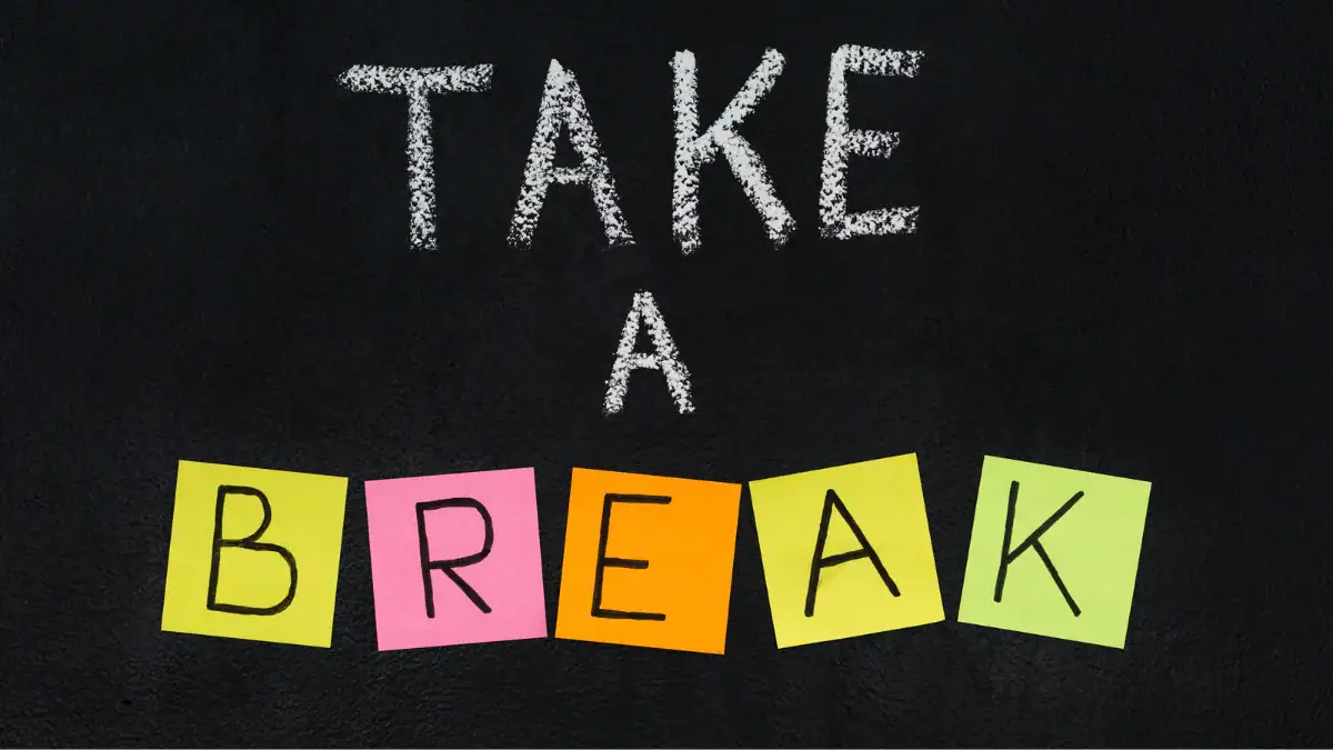 The phrase take a break written on a blackboard