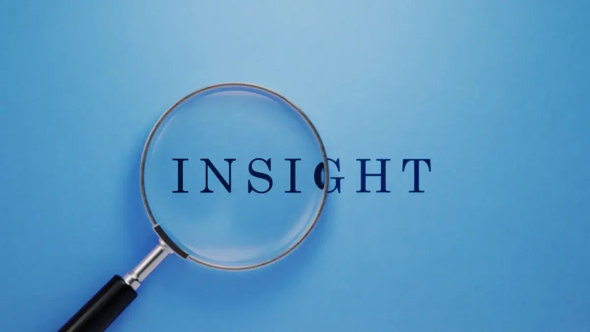 Professionals discussing business insights around a conference table