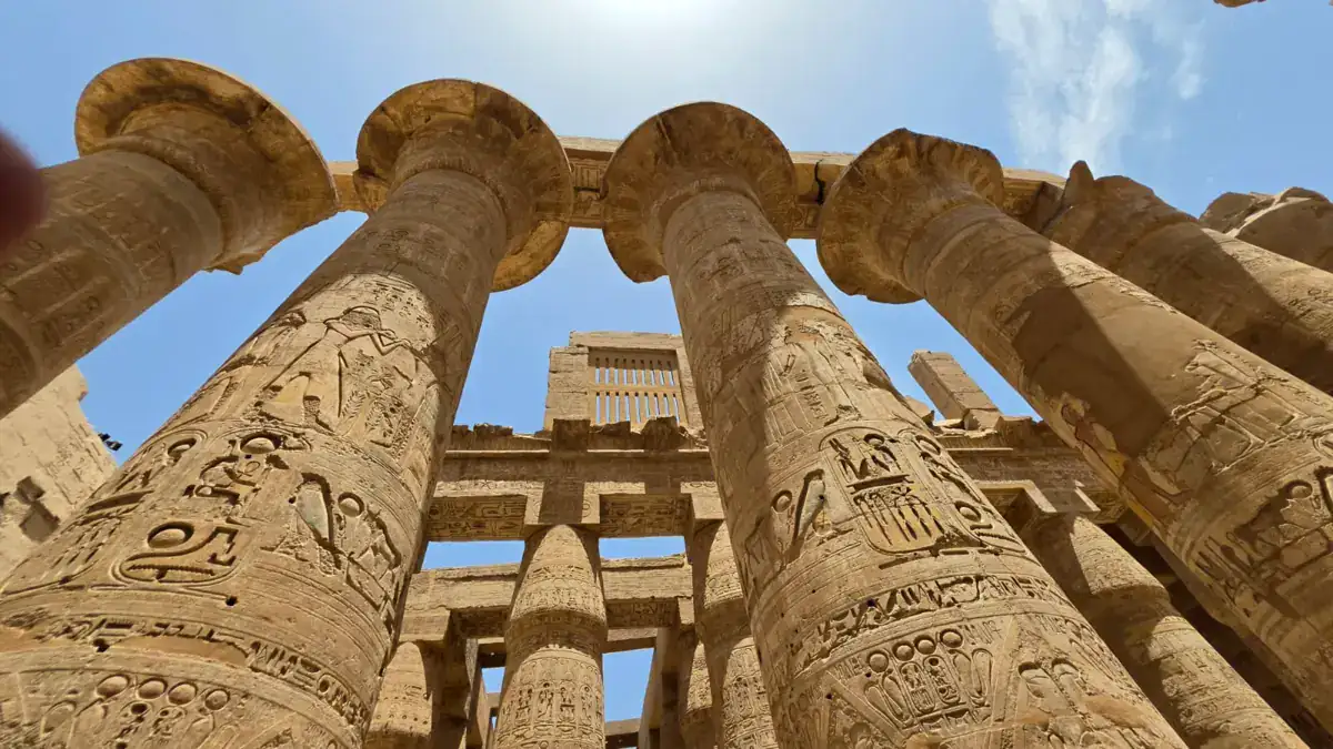 Monumental columns inside the Great Hypostyle Hall at Karnak Temple in Luxor