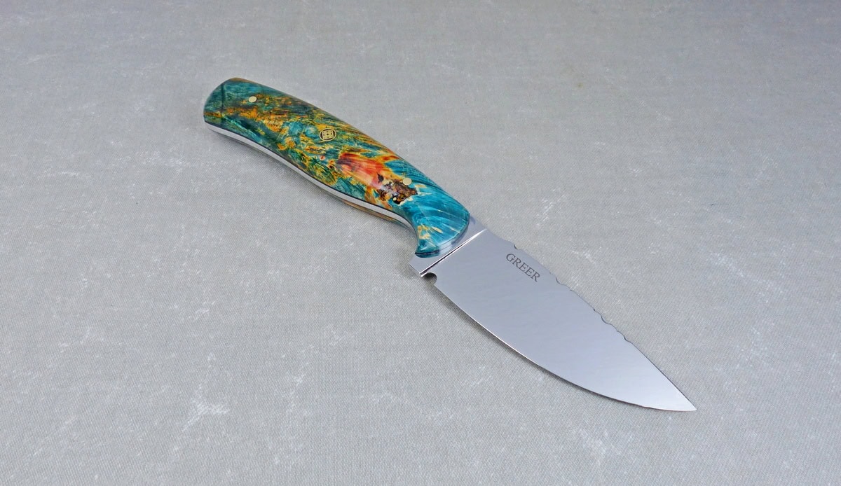 Side view of colorful maple hunting knife