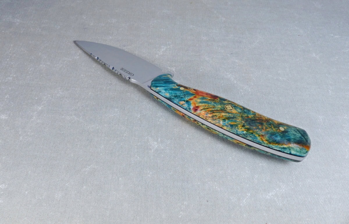 Top view of filework on colorful maple knife