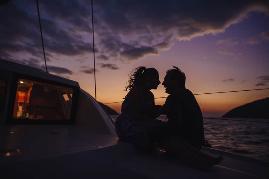 Couple on a boat at sunset, photographed by Koro Films