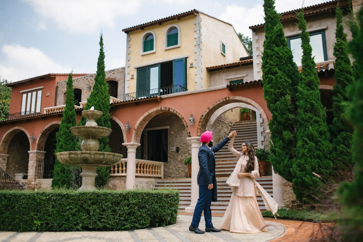 Couple in formal attire outside a European-inspired resort in Ratchaburi