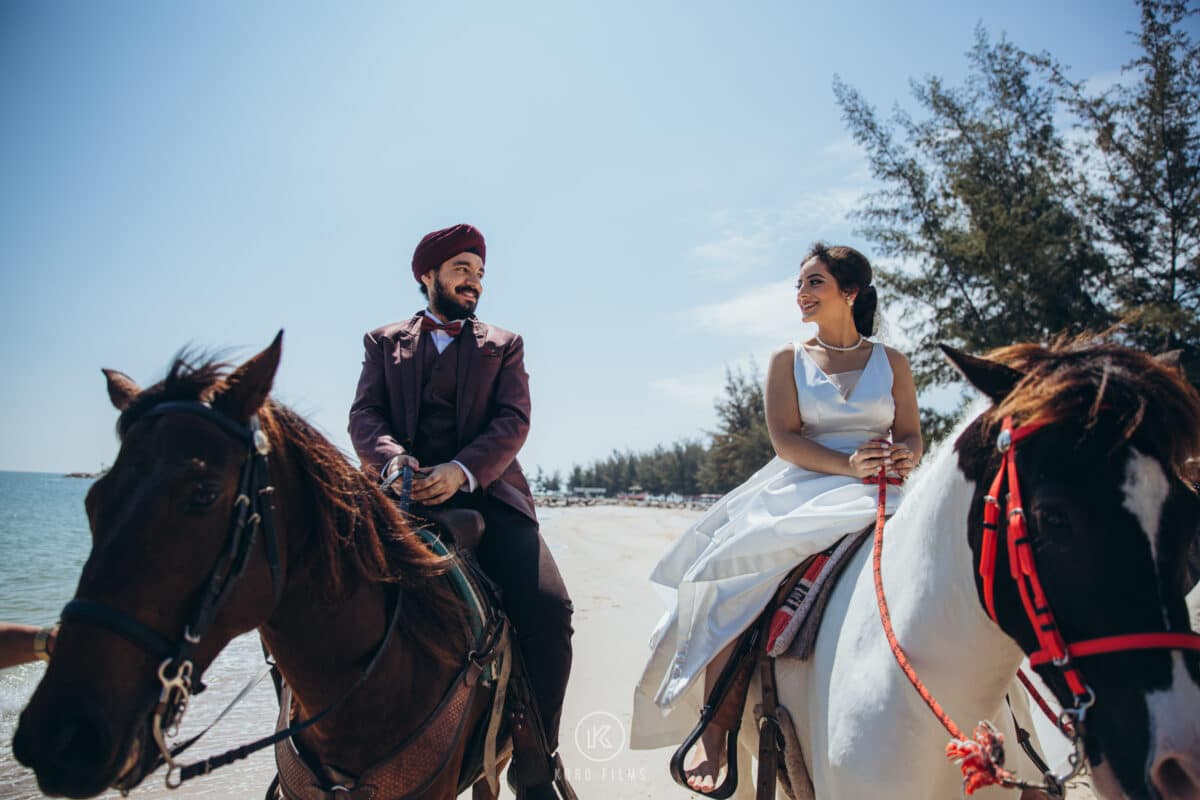 Gurdit and Nandeeta on horseback on the beach in Pattaya