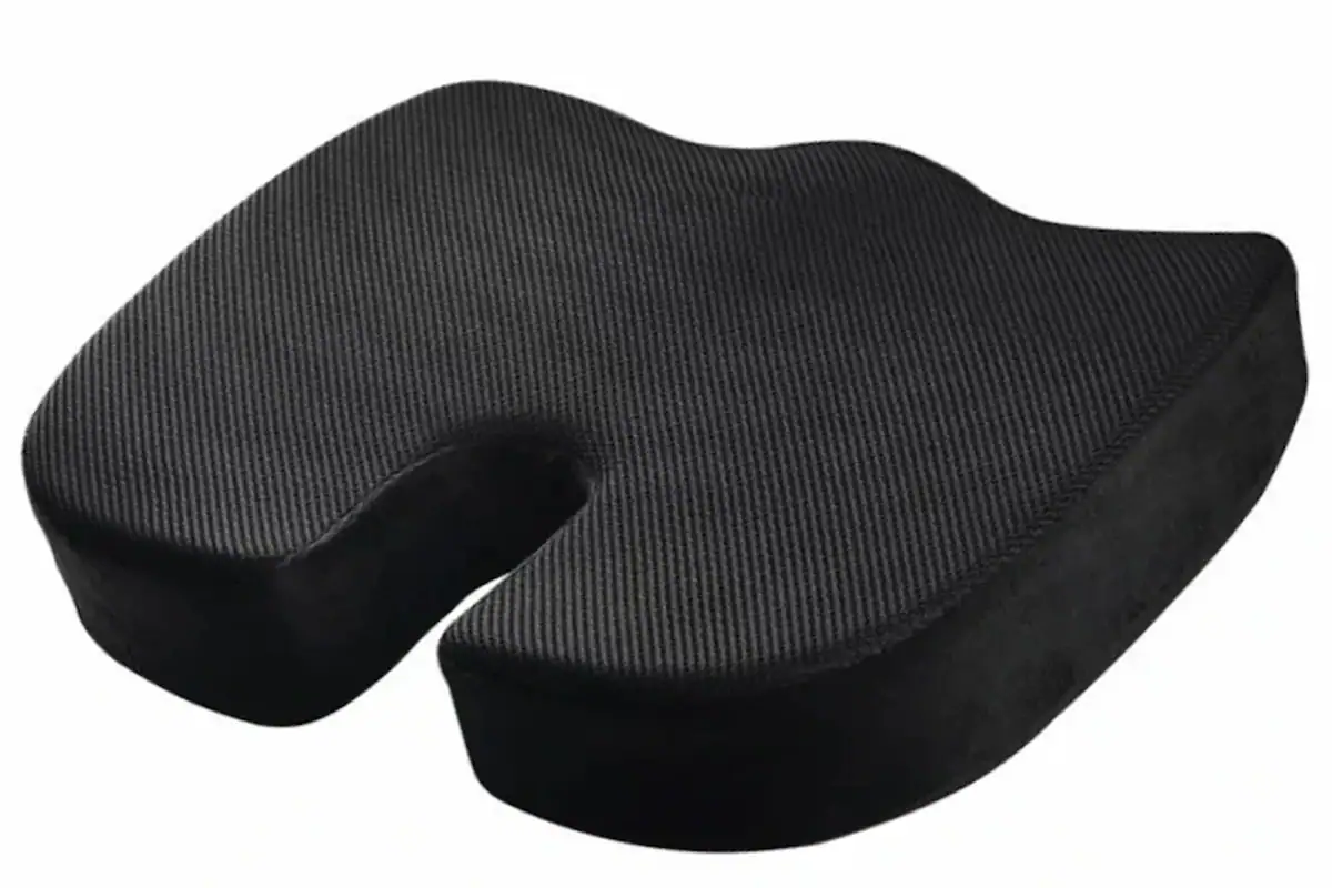 Seat cushion with a U-shaped rear cutout placed on an office chair