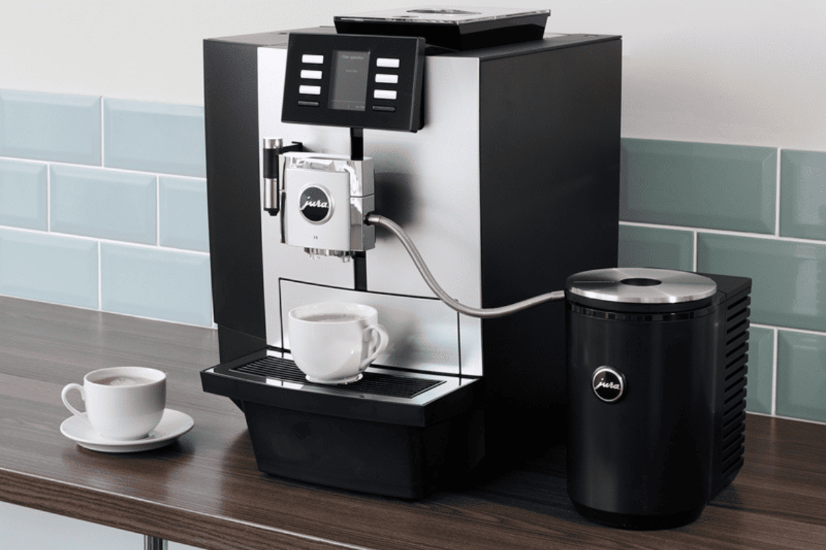 coffee machines on kitchen worktop with mug