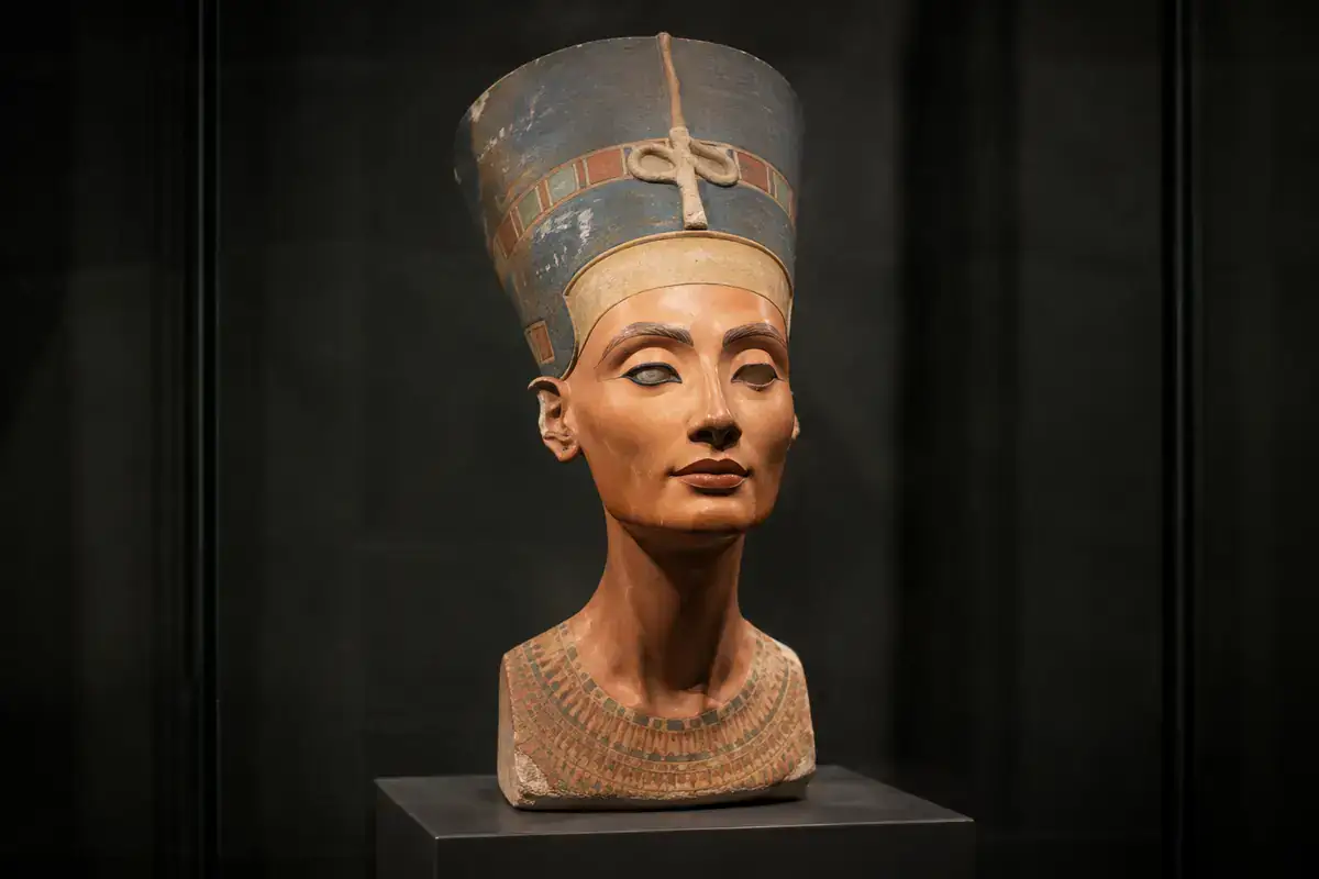 Nefertiti painted limestone bust displayed in a museum gallery in Berlin