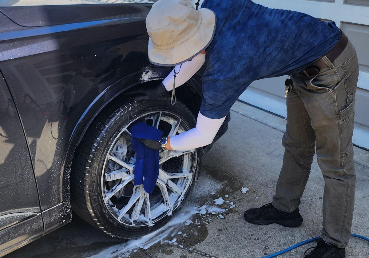 Guillermo hand-washing a wheel