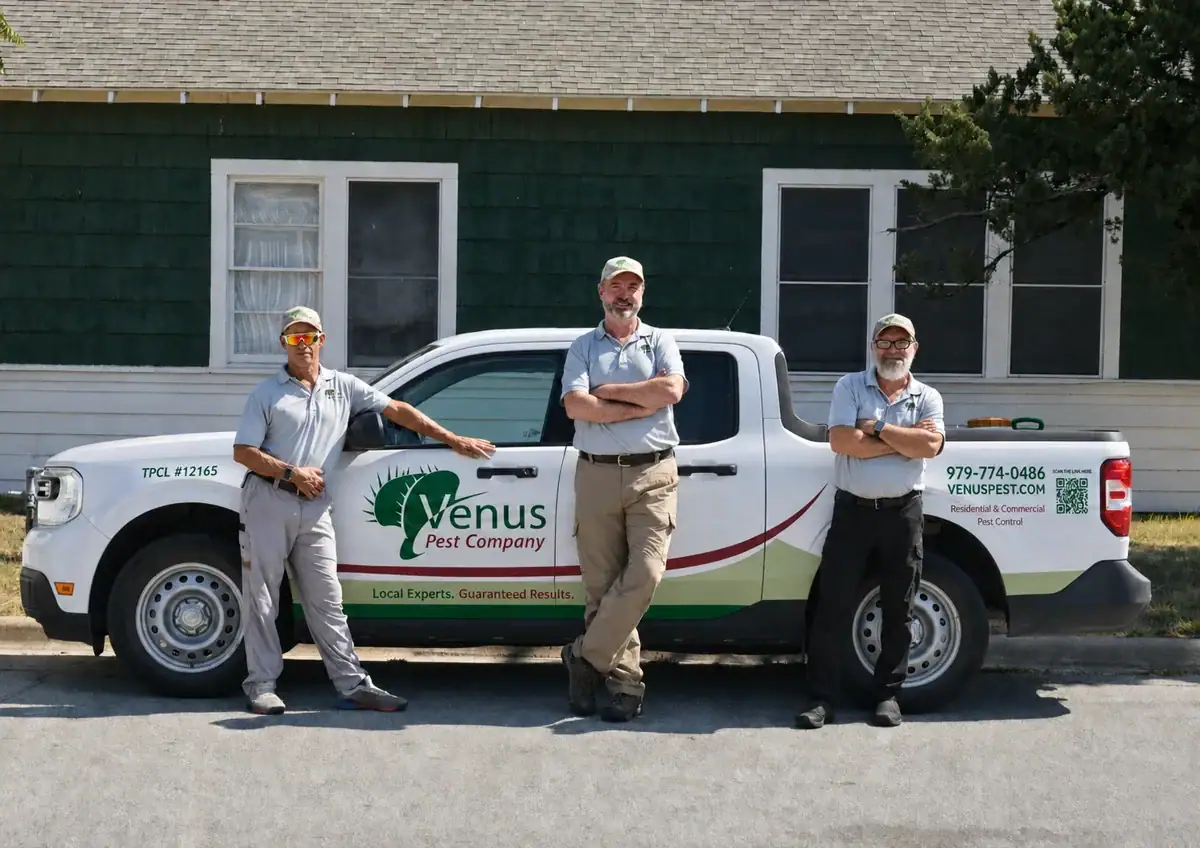 Dr. Scott Lingren and two Venus crew members beside their company truck