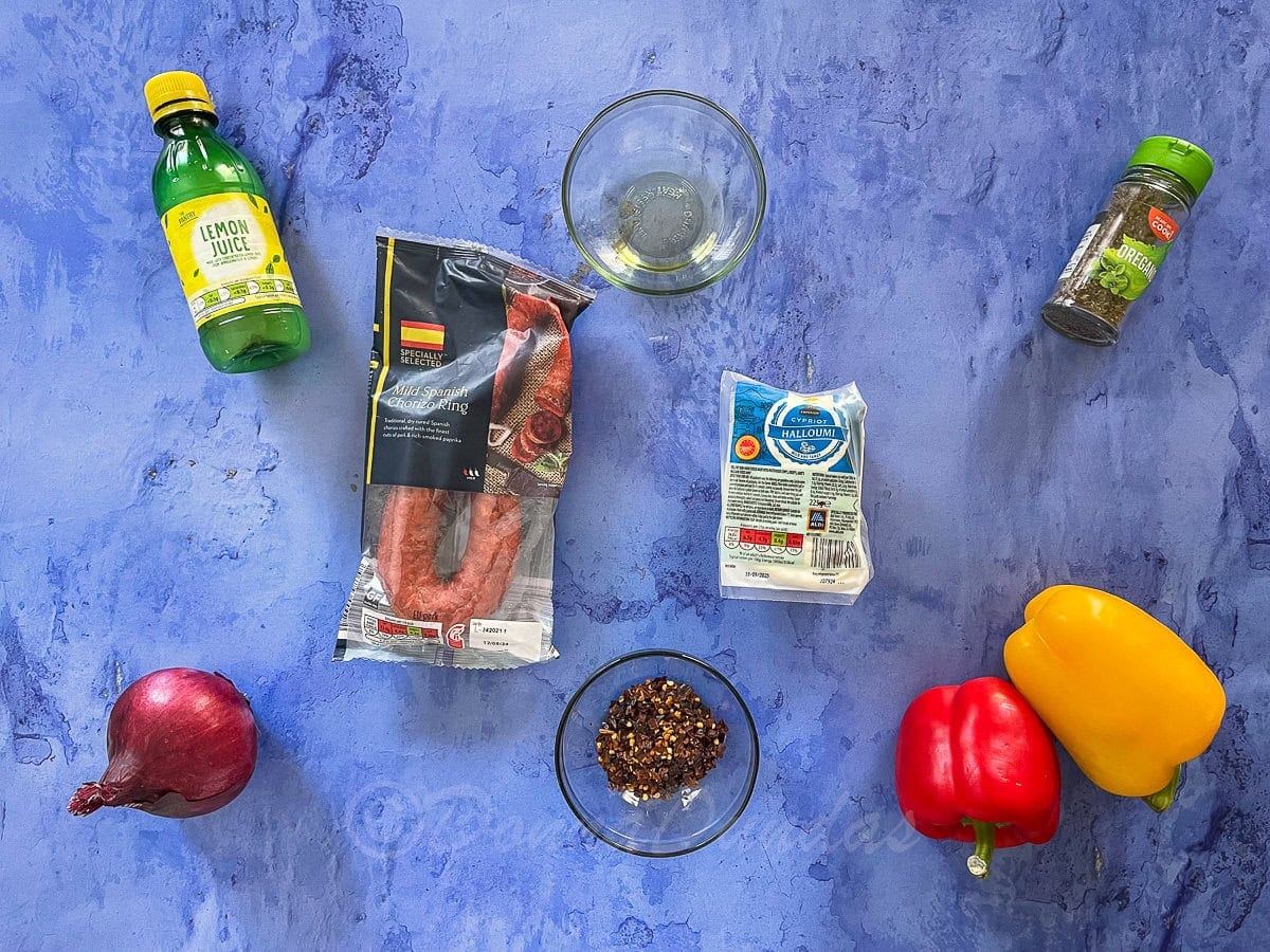 ingredients for halloumi and chorizo skewers on table.