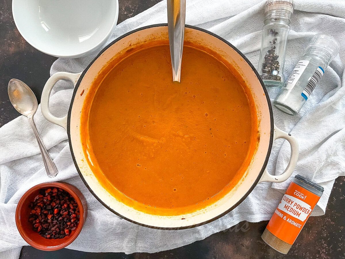 blended sweet potato and chorizo soup in Dutch Oven.