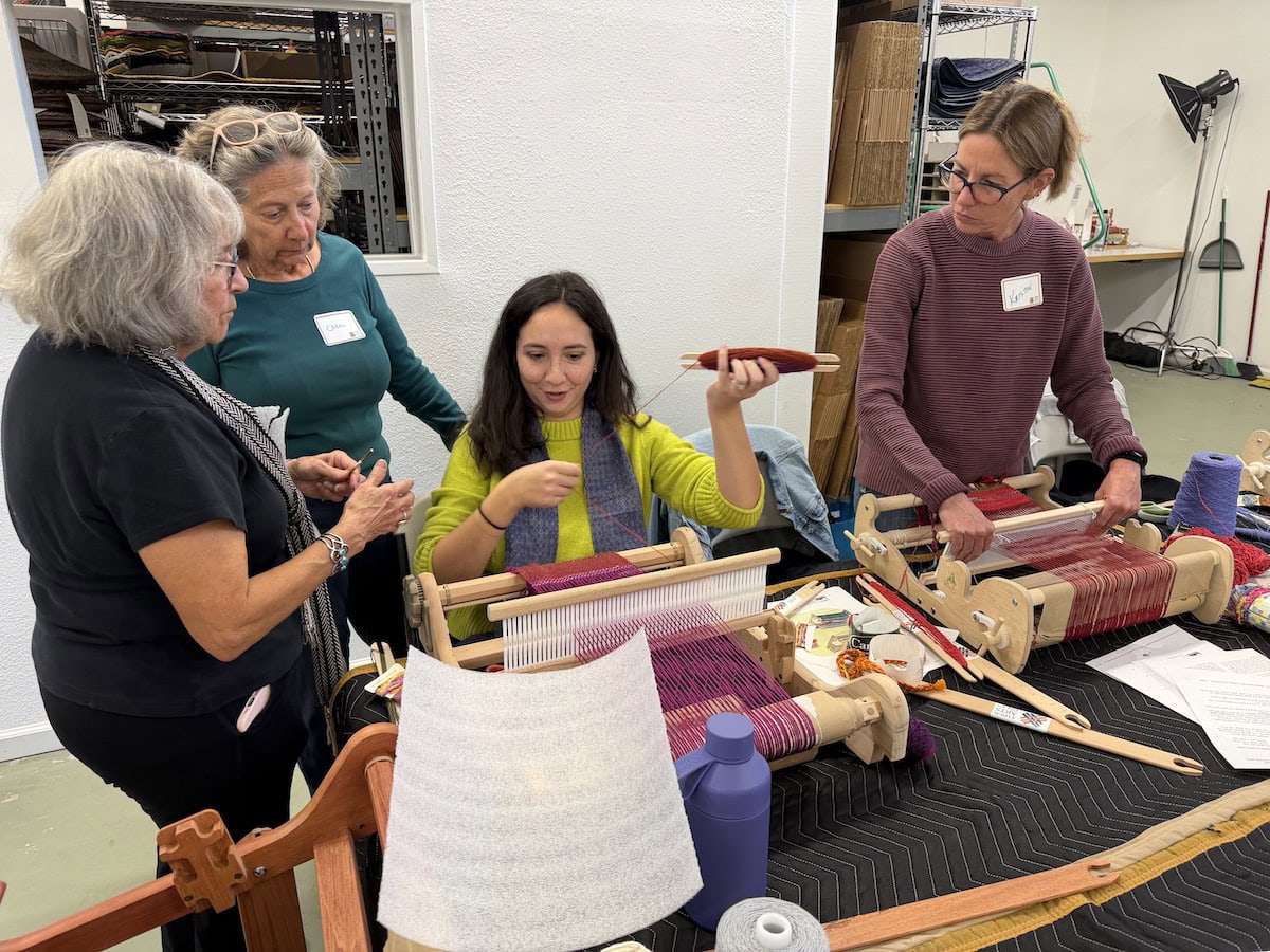 Woman weaving on loom