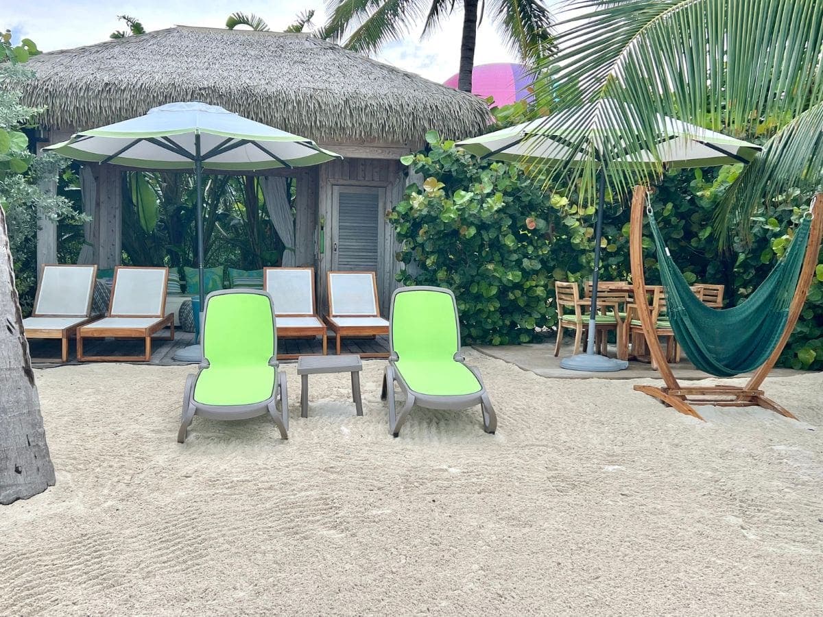 Coco Beach Club Cabana lounge chairs, hammock, and seating