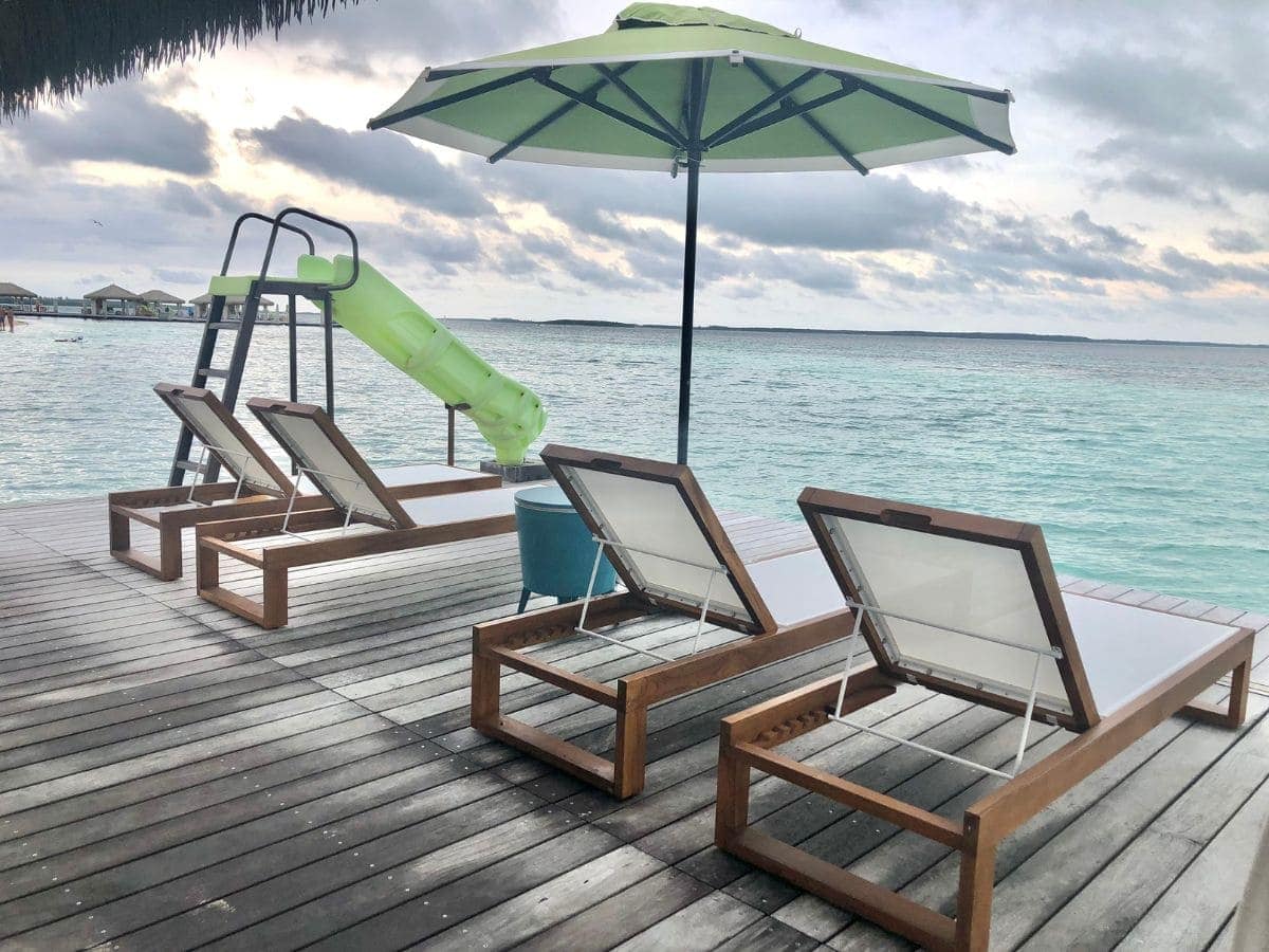 four loungers and water slide on cabana