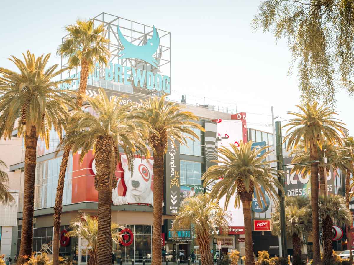 The Las Vegas strip in the sun, focusing on Brewdog and The Flyover Las Vegas location.