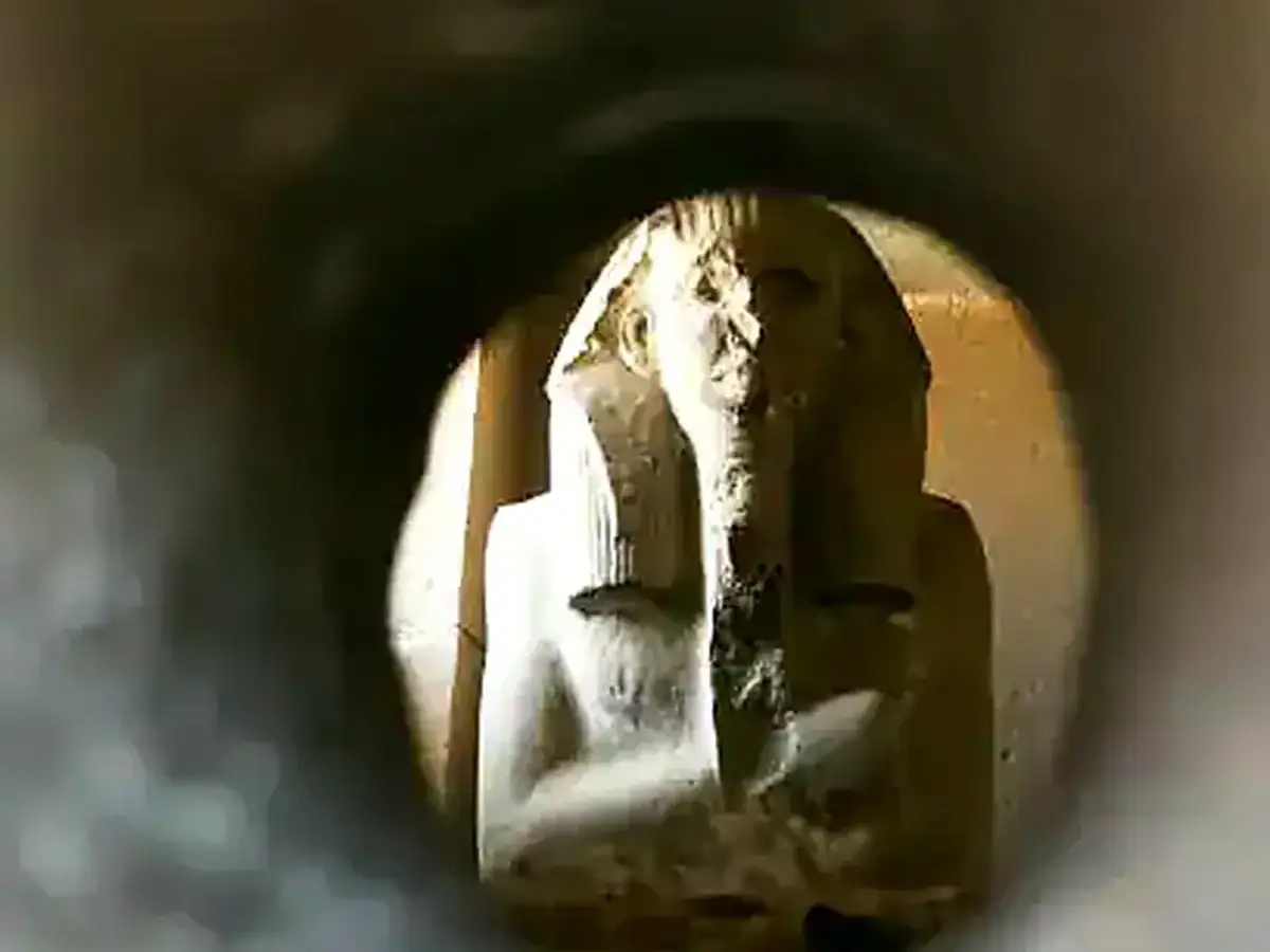 Royal statue viewed through the serdab openings