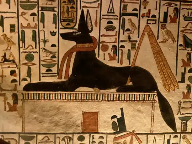 Painted Anubis resting above a shrine in Nefertari’s QV66