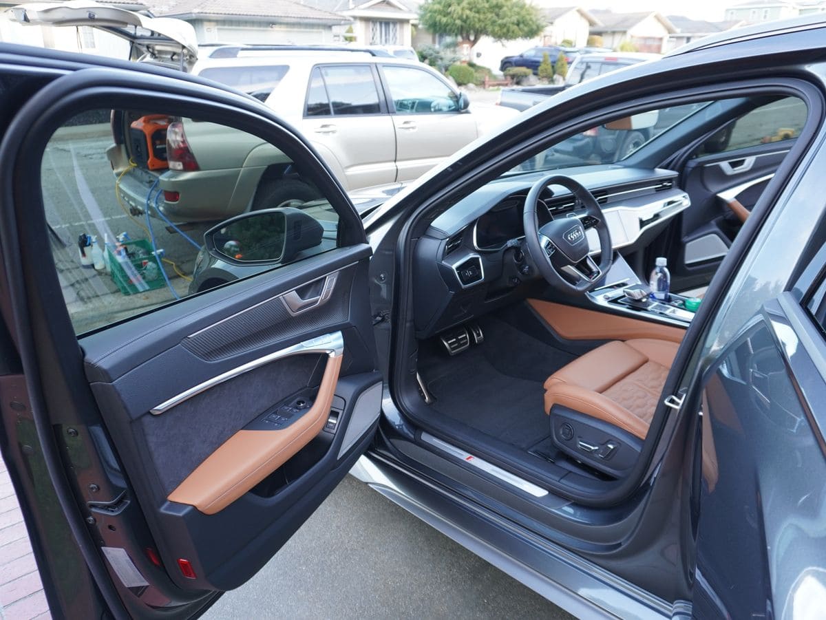 Open door showing an Audi's cognac leather interior
