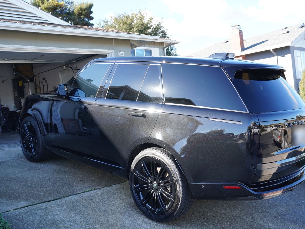 Home 7 The same Range Rover after the detail, its paint glossy enough to reflect the street