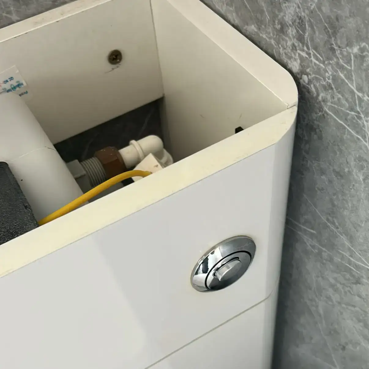 Toilet cistern dual flush button replacement and valve repair completed by NB Gas & Plumbing in Motherwell ML1