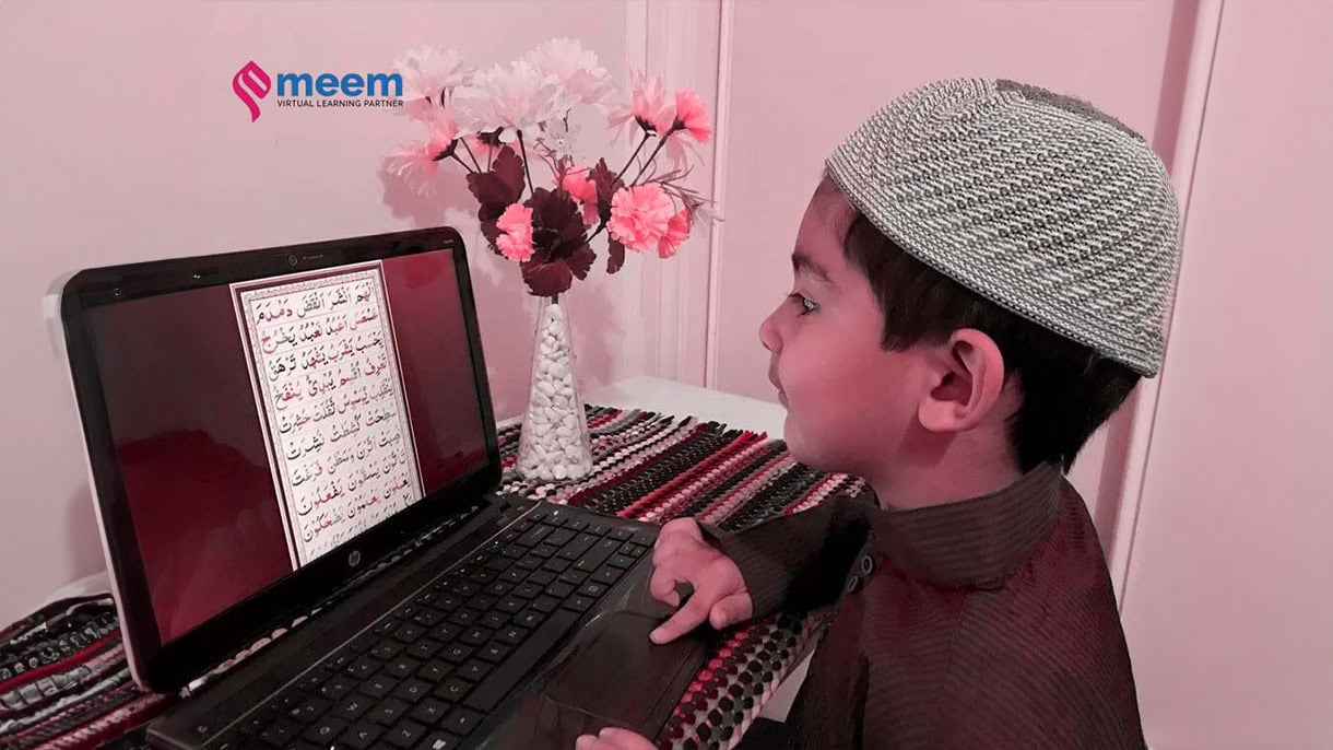Young Muslim boy learning Quran online on laptop, building strong moral values from an early age – Meem Virtual Learning Partner
