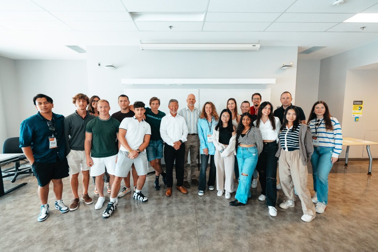 Group photo of participants at ABC Toronto 2023 and Captain Dan Buzz