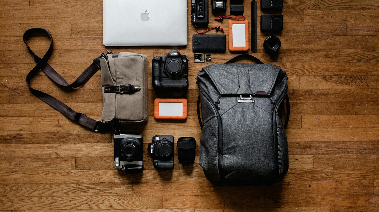 top view photo gadgets on hardwood floor