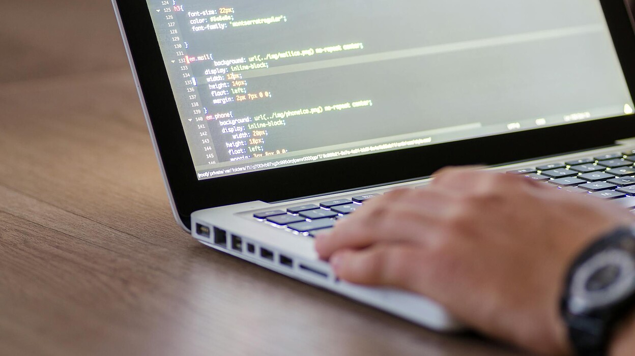 person using macbook pro