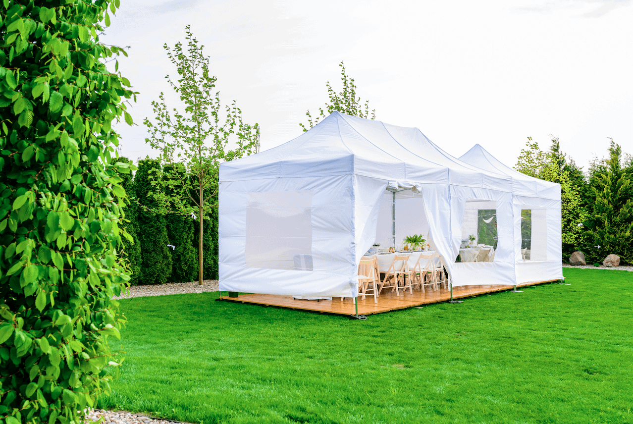 White frame tent rental set up for a private outdoor event in Myrtle Beach.