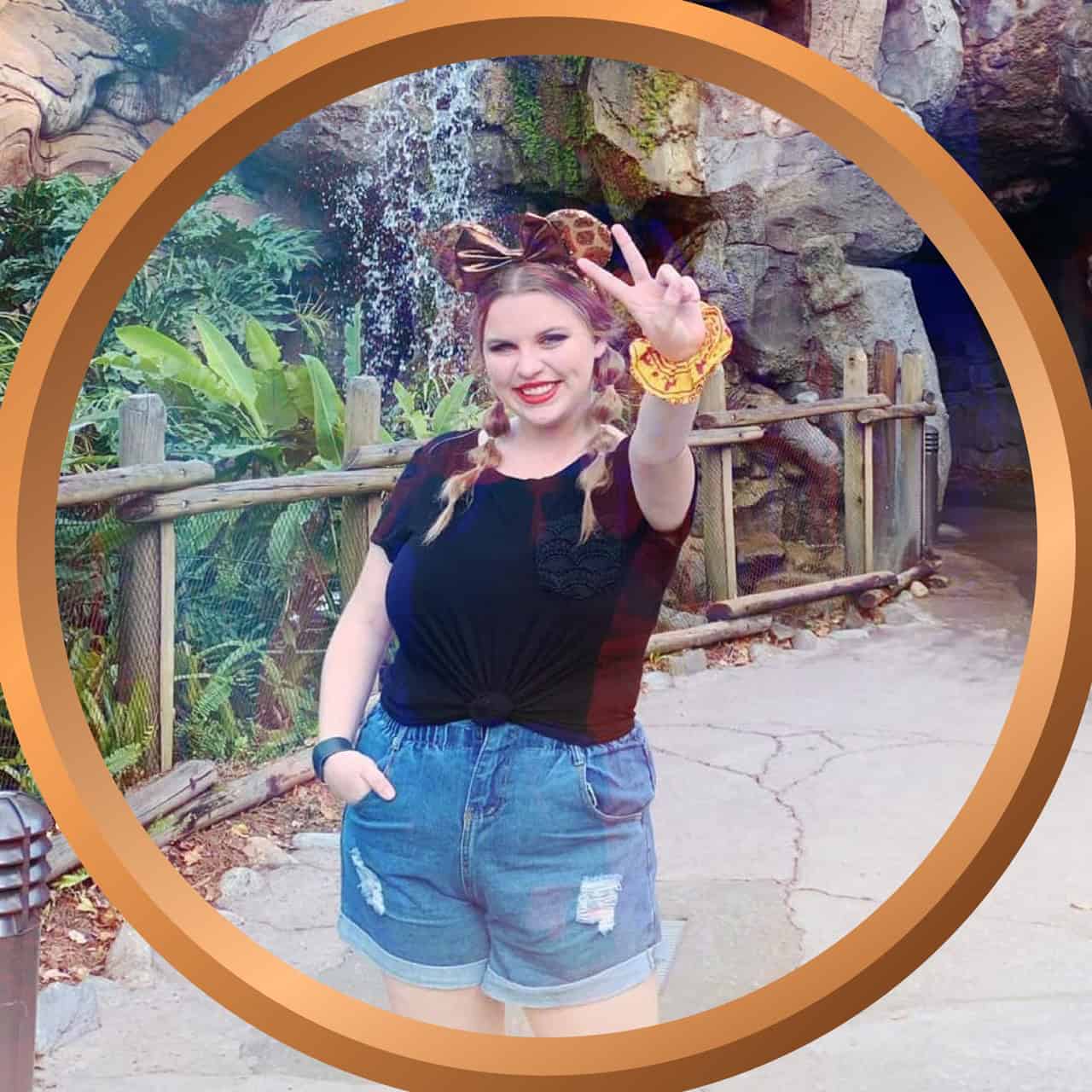 Vibrant woman enjoying a jungle-themed attraction at 407 and Beyond Vacation Co.