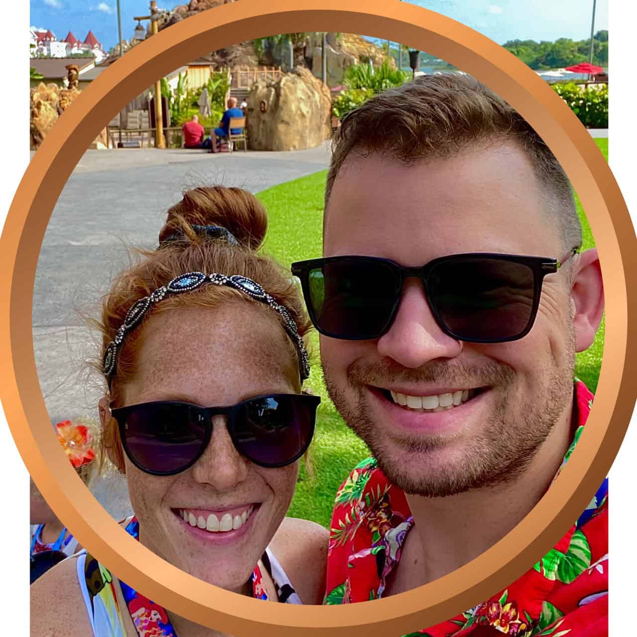 Vacation couple taking a selfie at a tropical resort or theme park.