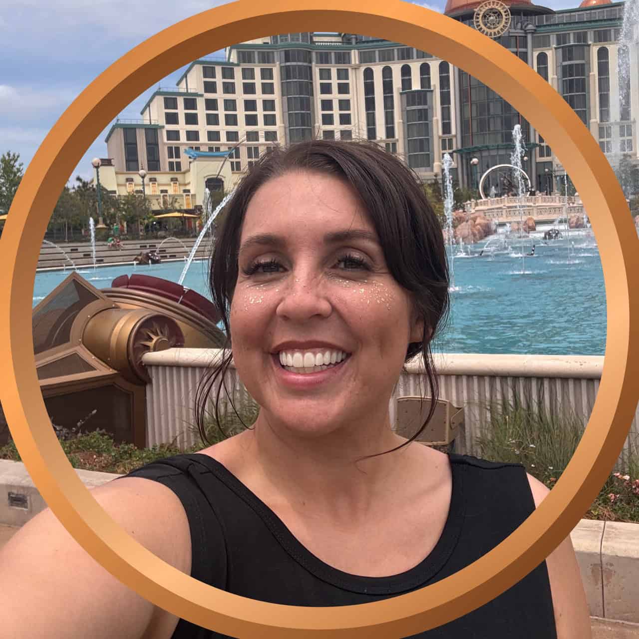 Beach vacation woman smiling at fountain in Orlando Florida.