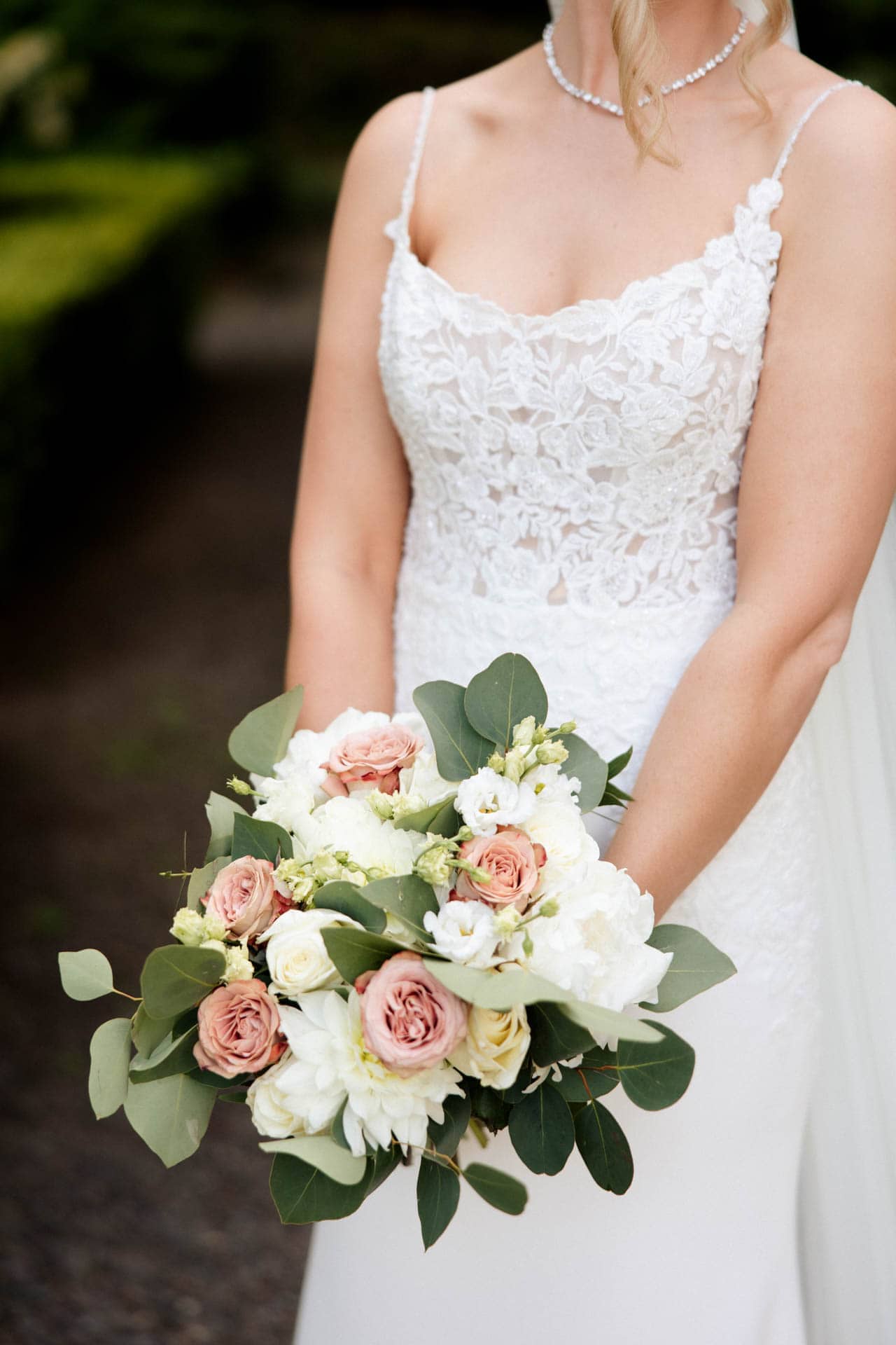bride and groom portraits in the gardens at eaves hall lancashire