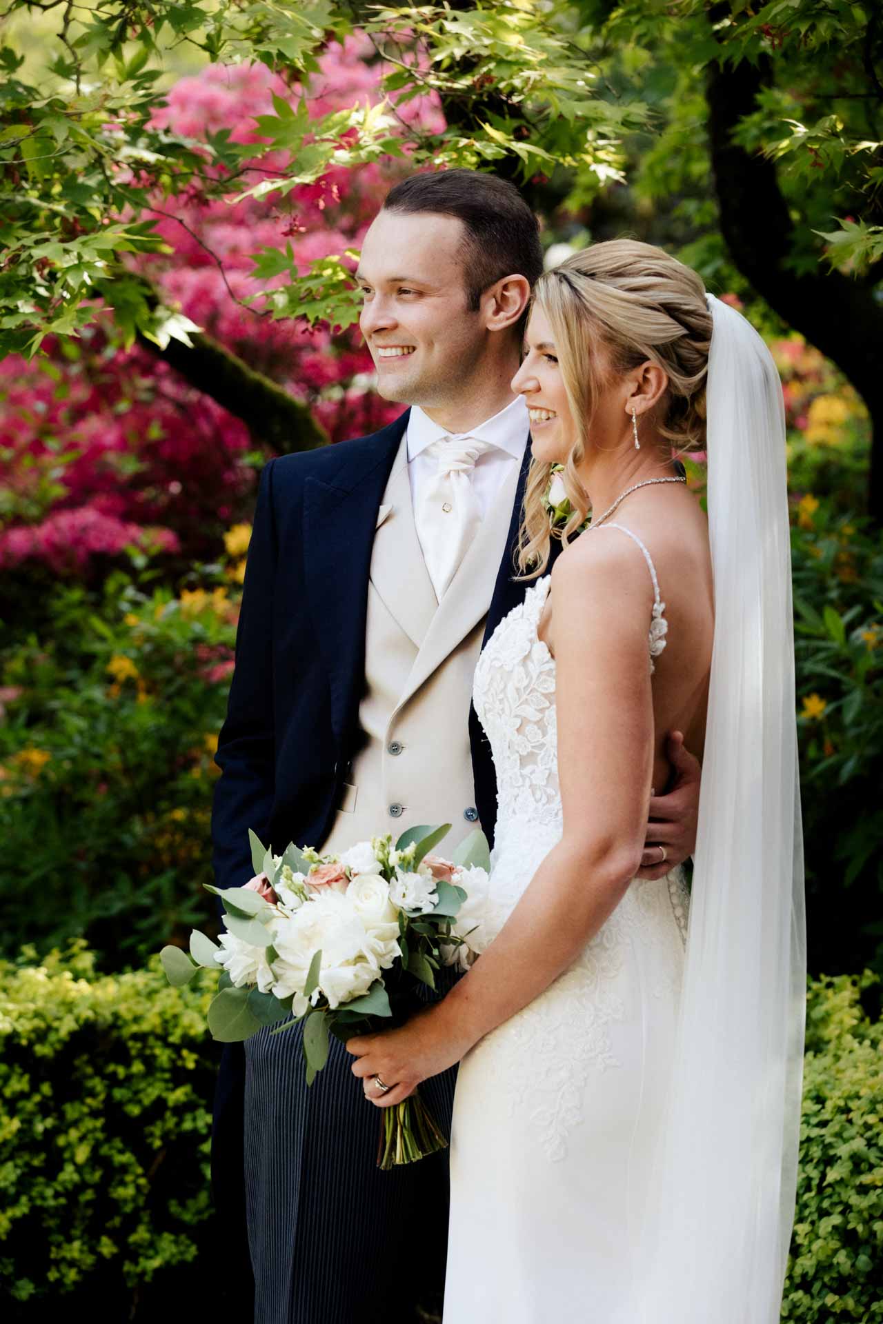 bride and groom portraits in the gardens at eaves hall lancashire