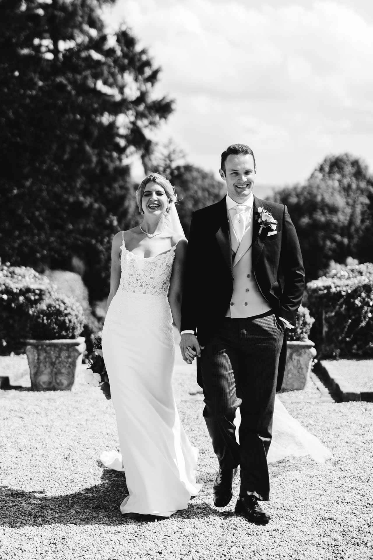 bride and groom portraits in the gardens at eaves hall lancashire