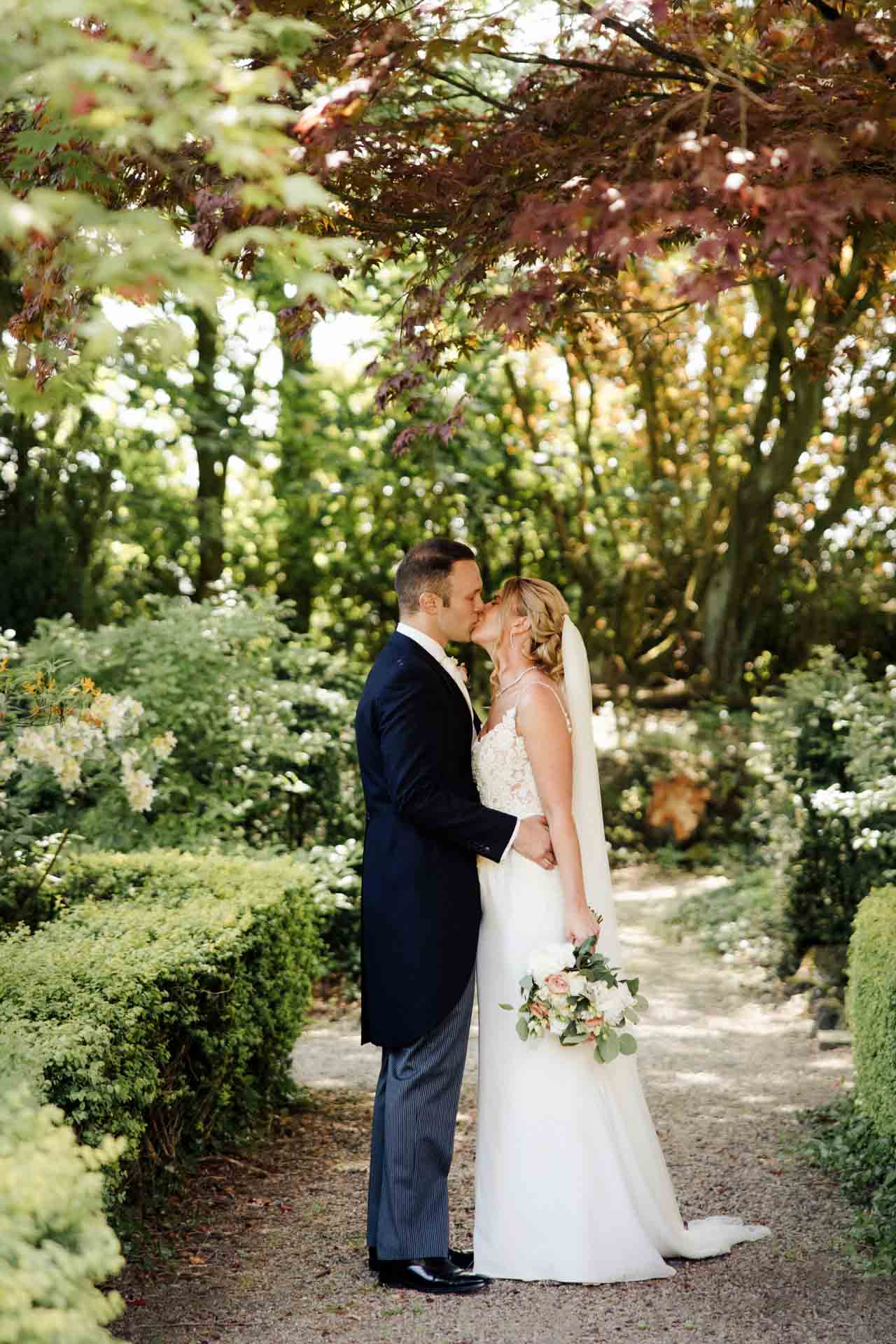 eaves hall wedding photography bride and groom in the gardens