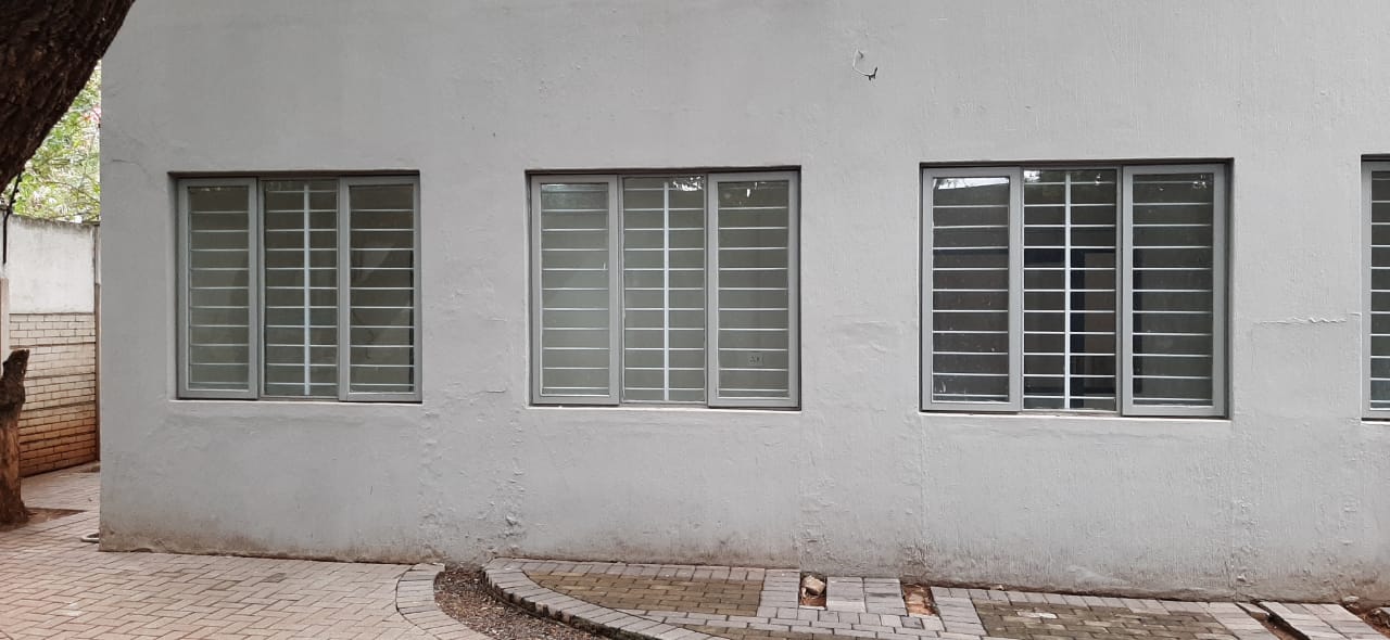 Exterior view of three windows fitted with Mini Valuebar window burglar bars for added home and office security.