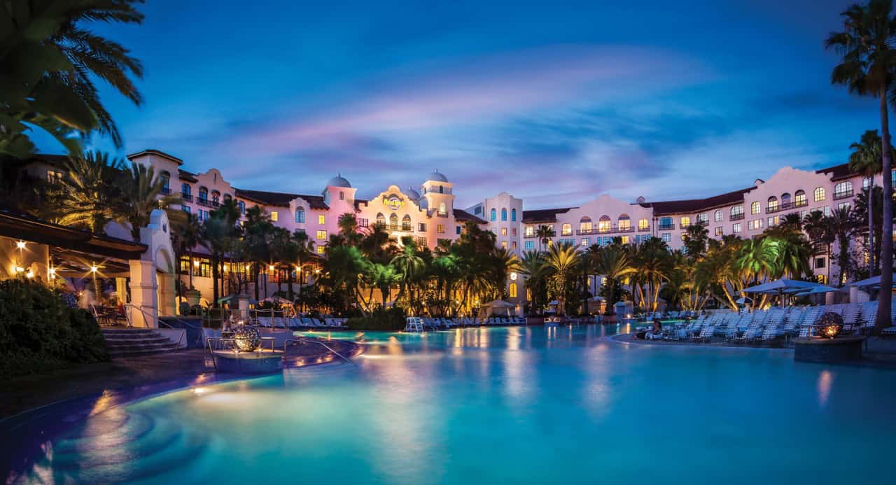 Luxurious resort with a scenic pool and vibrant sunset, perfect for relaxing vacations in Florida.