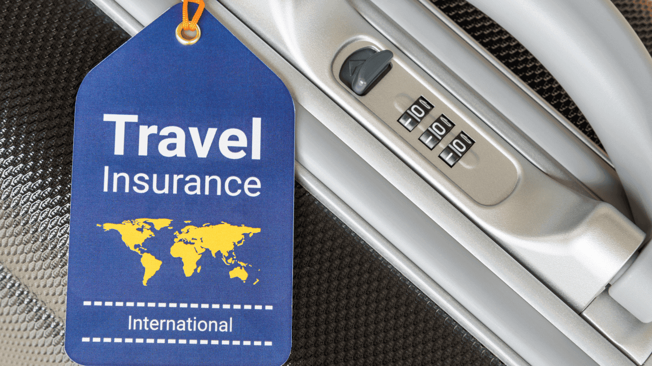Travel insurance tag on a suitcase for international travel.