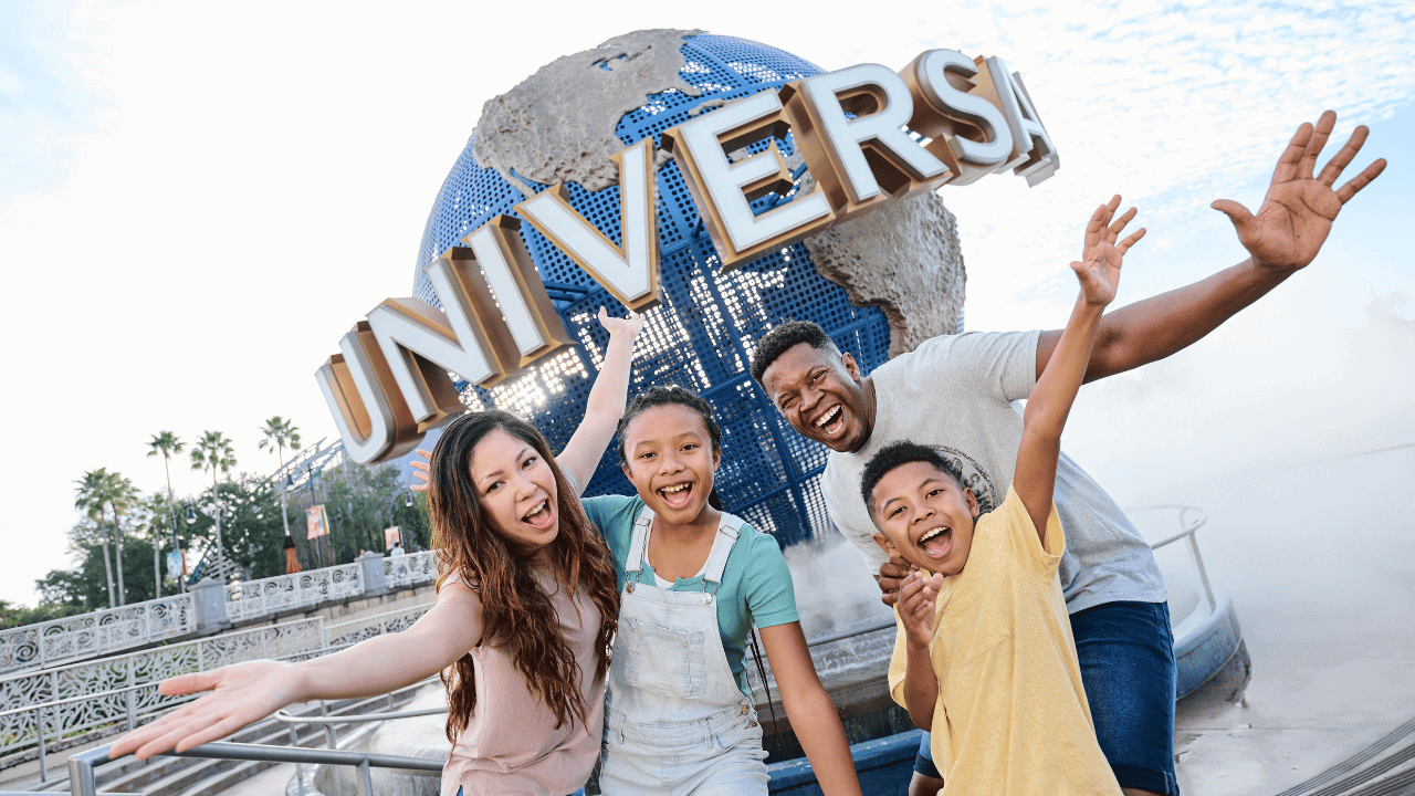 Happy family enjoying Universal Orlando theme park with globe backdrop.